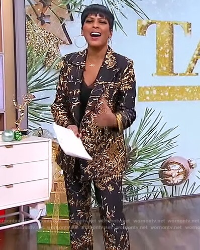 Tamron’s black floral metallic blazer and pants on Tamron Hall Show