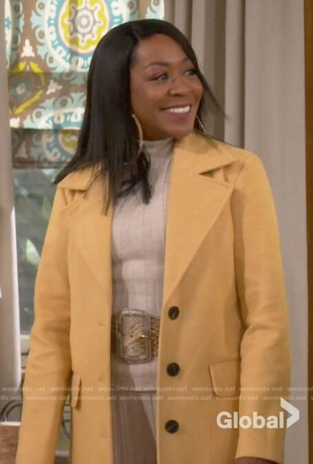Tina's yellow coat on The Neighborhood