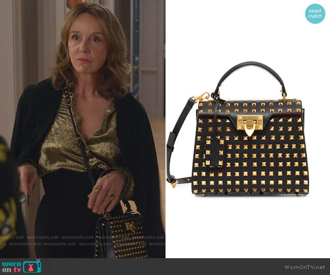 Small Alcove Rockstud Leather Top Handle Bag by Valentino Garavani worn by Sylvie (Philippine Leroy-Beaulieu) on Emily in Paris