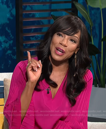 Wendy Raquel Robinson’s pink pleated sleeve top on E! News Daily Pop
