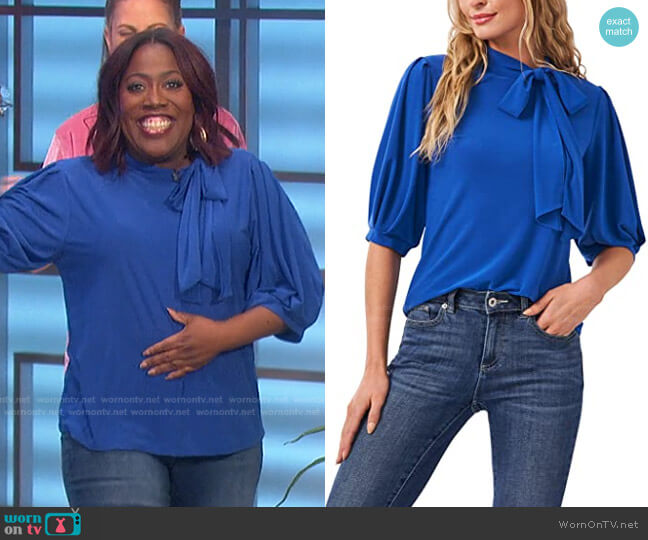 Puff Sleeve Crepe Knit Top with Bow by Cece worn by Sheryl Underwood  on The Talk