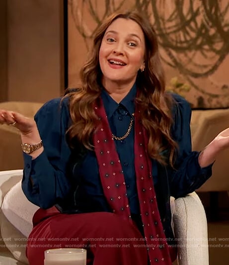 Drew’s navy blouse with chain detail on The Drew Barrymore Show