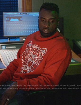 Eric’s red tiger embroidered sweatshirt on Queens