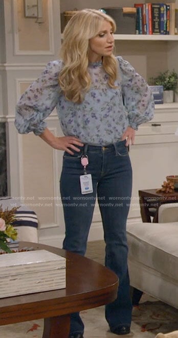 Gina's blue floral blouse and flare jeans on B Positive