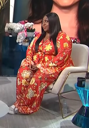 Loni’s red floral jumpsuit on E! News Daily Pop