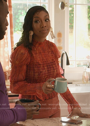 Naomi’s red printed smocked top on Queens