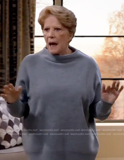 Norma's blue mock neck sweater on B Positive