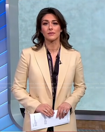 Erielle Reshef’s black printed blouse and beige blazer on Good Morning America