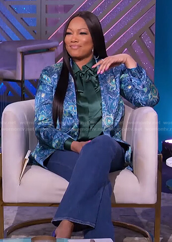 Garcelle's green tie neck blouse and blue printed blazer on The Real