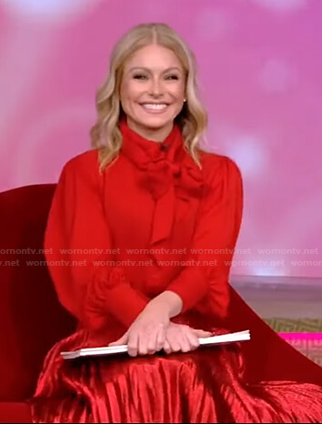 Kelly's red tie neck blouse and pleated skirt on Live with Kelly and Ryan