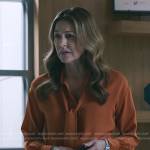 Kit’s orange tie neck blouse on The Resident