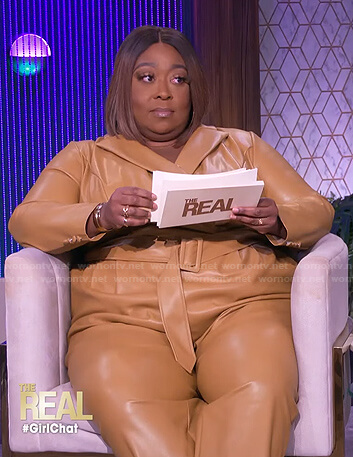 Loni’s beige belted leather jumpsuit on The Real
