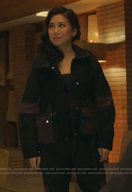 Mel’s black utility jacket with purple pockets on The Equalizer