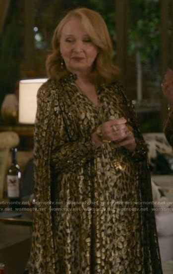 Nora's gold leopard print cape gown on Inventing Anna