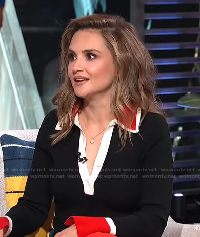 Rachael Leigh Cook’s black contrast trim polo sweater on E! News Daily Pop