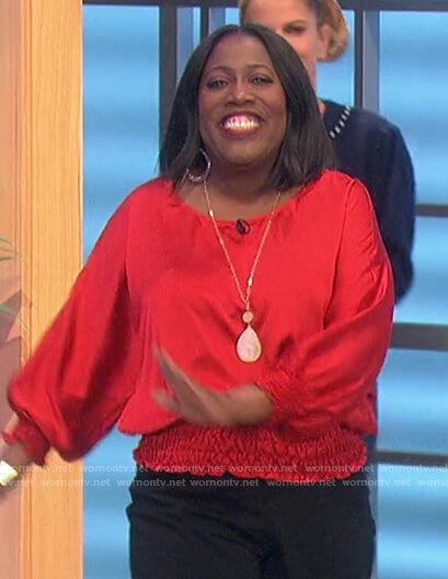 Sheryl’s red smocked waist top on The Talk