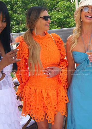 Adriana's orange eyelet mini dress on The Real Housewives of Miami