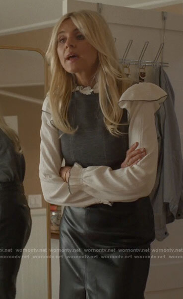 Amy's white ruffled sweater and grey checked top on Pivoting