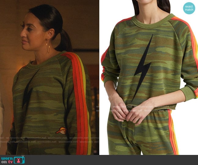 Bolt Stripe Camo Cropped Sweatshirt by Aviator Nation worn by Ana Torres (Francia Raisa) on Grown-ish