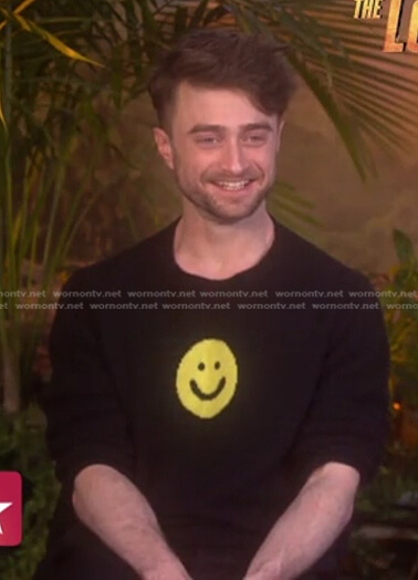 Daniel Radcliffe’s black smiley face sweater on Access Hollywood