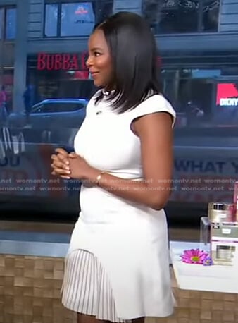 Dr. Michelle Henry’s white pleated hem dress on Good Morning America