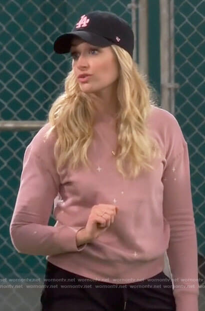 Gemma’s pink star embroidered sweatshirt on The Neighborhood
