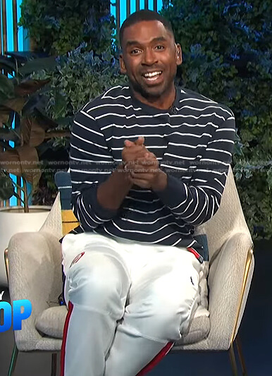 Justin's navy striped top and white jogger pants on E! News Daily Pop