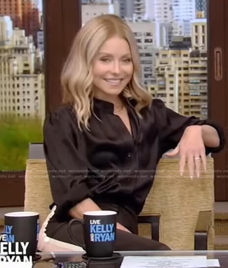 Kelly’s black blouse and side striped pants on Live with Kelly and Ryan