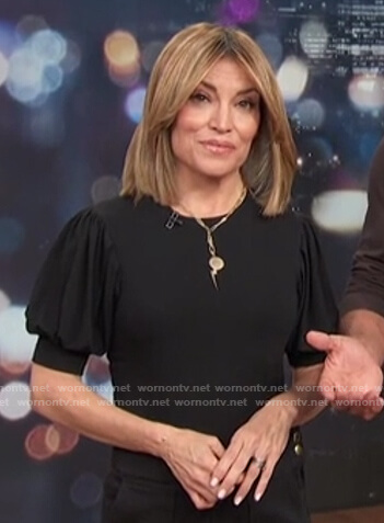 Kit’s black puff short sleeve top on Access Hollywood