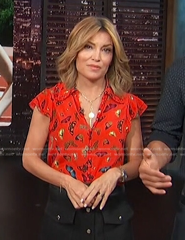 Kit’s red butterfly print blouse on Access Hollywood
