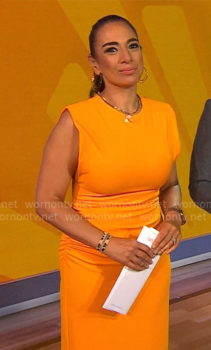 Michelle Miller’s orange midi dress on CBS Saturday Morning