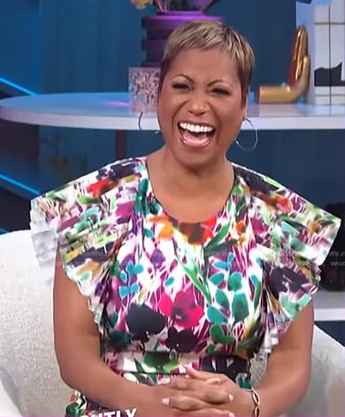 Monique’s printed pleated sleeve dress on E! News Nightly Pop