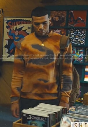 Nathan’s orange printed sweatshirt on Naomi