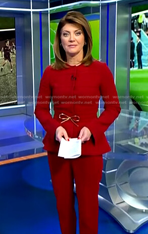 Norah's red peplum jacket and pants on CBS Evening News