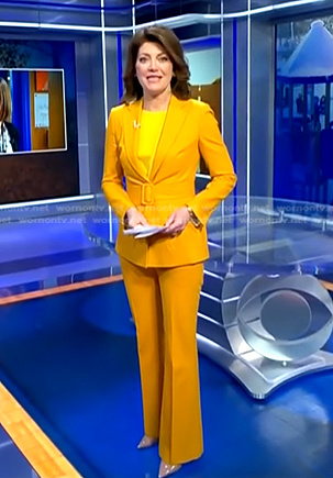 Norah's yellow belted suit on CBS Evening News