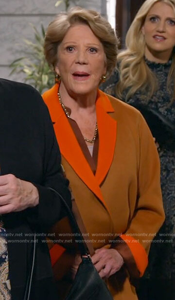Norma’s tan and orange jacket on B Positive