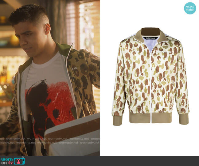 Camouflage-print Track Jacket by Palm Angels worn by Vivek Shah (Jordan Buhat) on Grown-ish