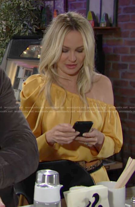 Sharon’s yellow one-shoulder blouse on The Young and the Restless