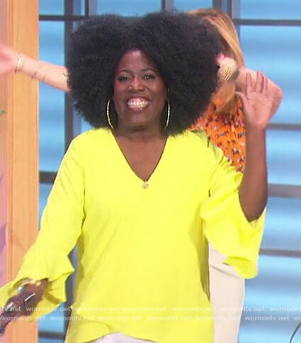 Sheryl’s yellow ruffle sleeve top on The Talk