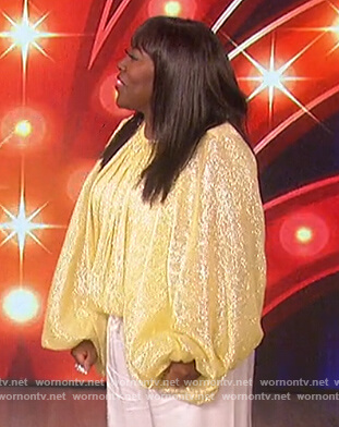 Sheryl's yellow metallic top on The Talk