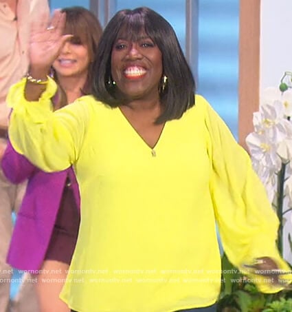 Sheryl’s yellow smocked v-neck top on The Talk