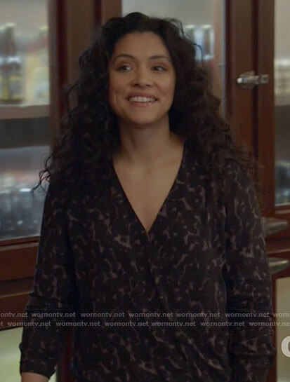Stella’s black leopard print cross front blouse on Chicago Fire