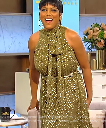 Tamron’s green metallic tie neck dress on Tamron Hall Show