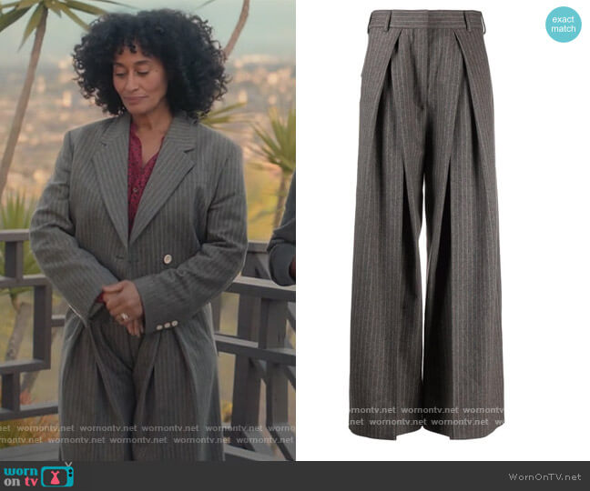 Pinstripe box pleated flared trousers by Acne Studios worn by Rainbow Johnson (Tracee Ellis Ross) on Blackish