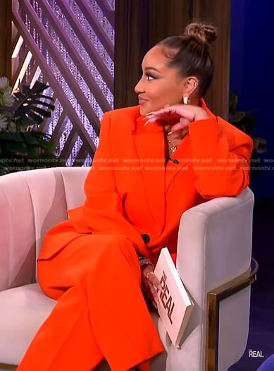 Adrienne's orange blazer and pants on The Real