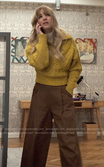 Cassie's yellow cable knit sweater and brown wide leg pants on The Flight Attendant
