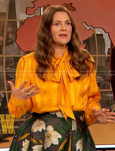 Drew’s yellow tie neck blouse and floral embroidered skirt on The Drew Barrymore Show