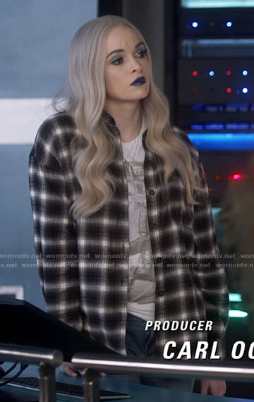 Frost's white graphic tee and black plaid shirt on The Flash