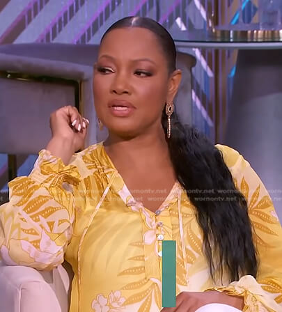 Garcelle's yellow floral tie neck top on The Real