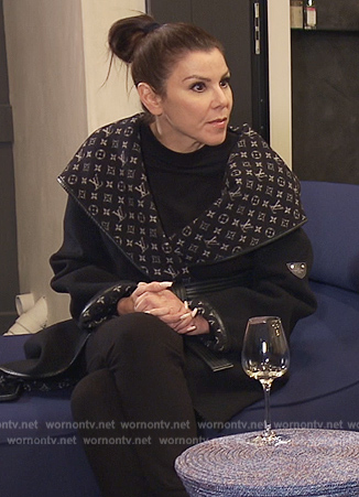 Heather's black Louis Vuiton logo coat on The Real Housewives of Orange County